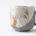 Rabbits In Sunny Spot Mug